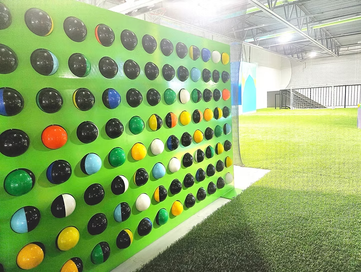 Interactive sports wall and indoor turf at Funrise Indoor Playground